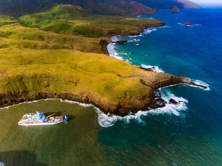 View of the Aranui 5 South Sea cruise at the coast of Ua Huka, Marquesas Islands, French Polynesia