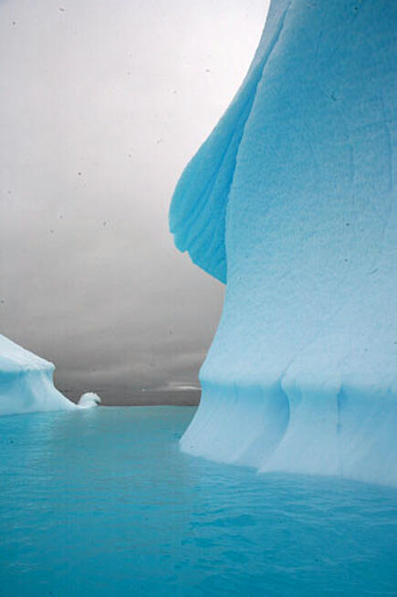 View of the icy glacier landscape of Antarctica from the sailing yacht Santa Maria Australis