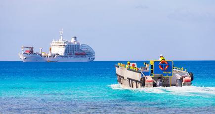 The cargo ship Aranui 5 with pontoon for whale watching at Rangiroa Atoll, French Polynesia