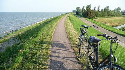 Sailing with Bycicle, path near Ijsselmeer, Netherlands